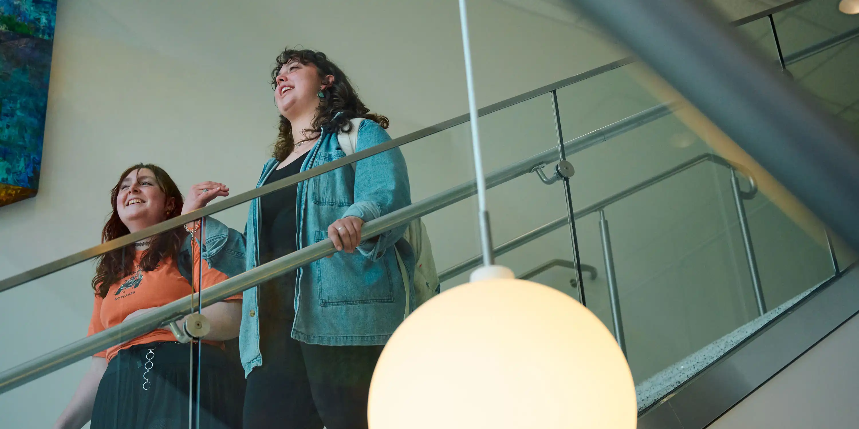 Two students walking down the stairs