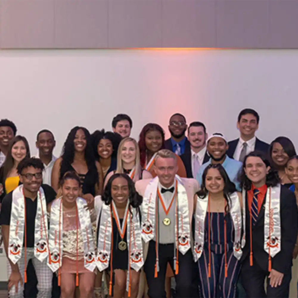 ​​Group of students with graduation cords​ 