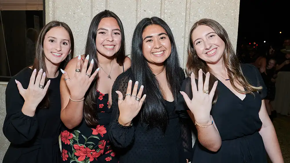 SHSU Students posing with the official ring